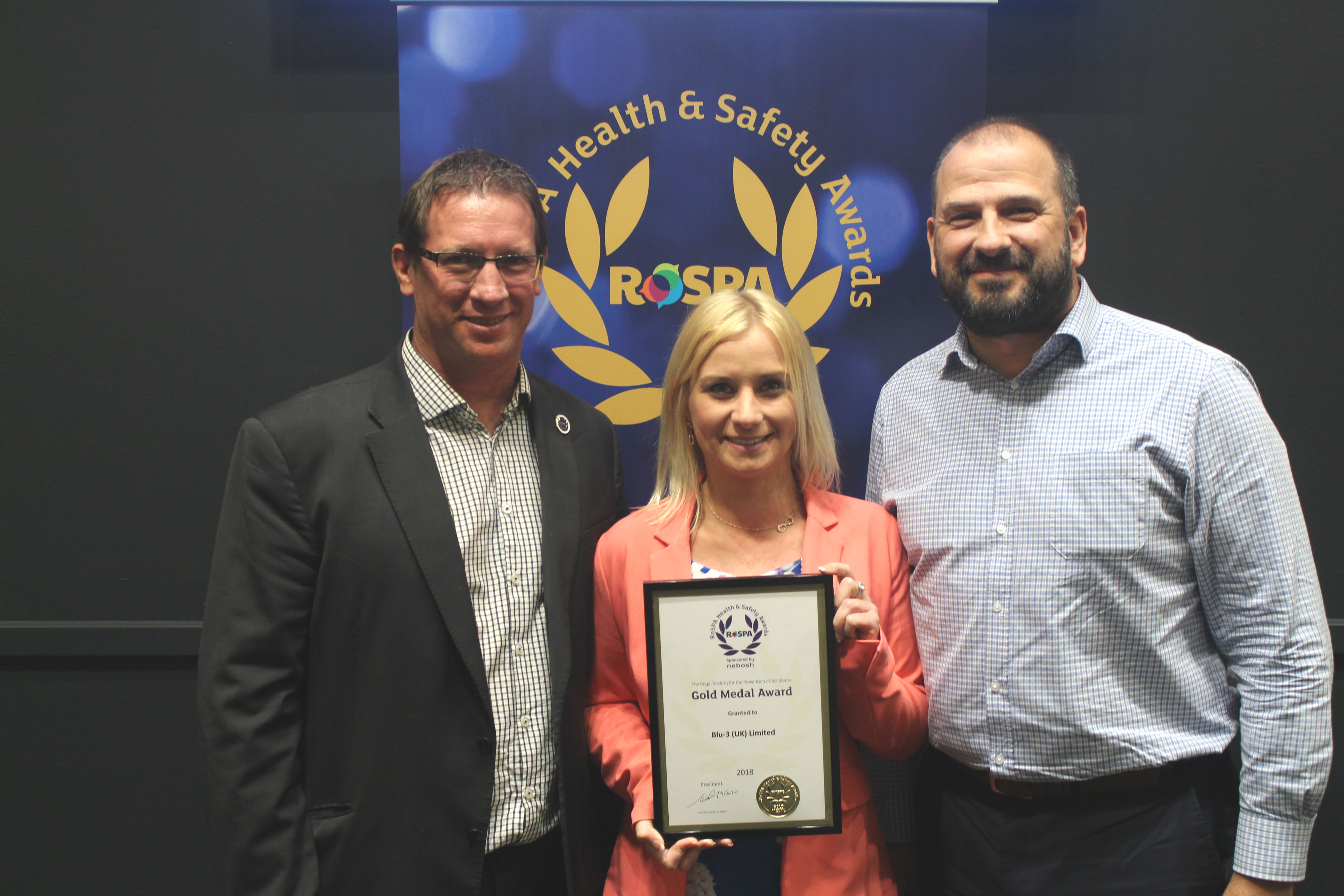 blu-3 RoSPA success - Coenraad Fourie, Phil Douce and Linda Daly from blu-3 collect the award
